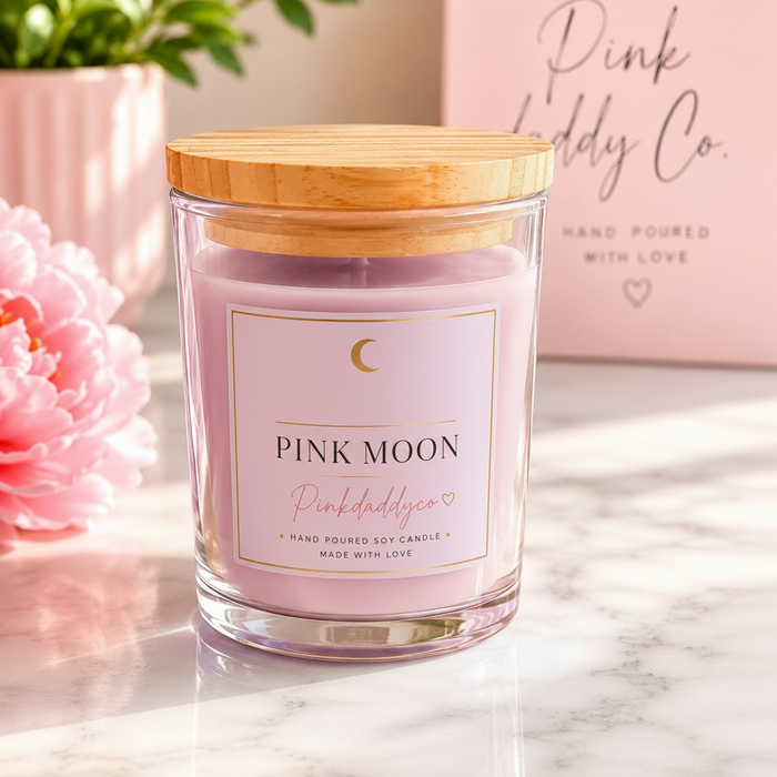 Pink Moon 8oz hand-poured soy candle by Pink Daddy Co. in glass jar with wood lid on marble surface